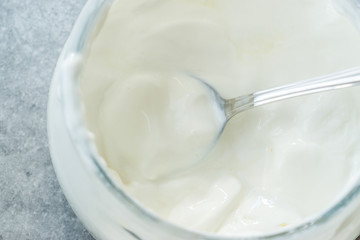 Homemade Goat Yogurt in Glass Bowl with Spoon / Probiotic Custard