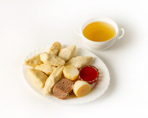 A dish of Dagestan cuisine, Avar khinkal with beef on a white background