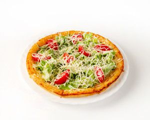 Caesar pizza with chicken on a plate side view