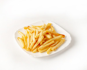 Portion of french fries on a plate side view on a white background