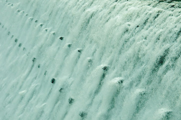 Gushing water going over the top of the dam at Elan valley, Wales.