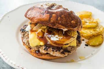 Homemade Hamburgers with Cheddar Cheese and Caramelized Onions