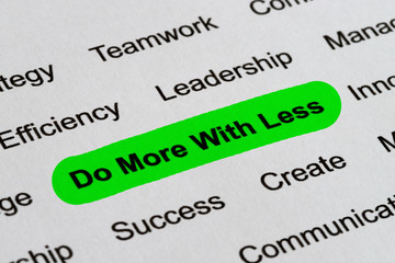 Do More With Less - Business Buzzwords, printed on white paper and highlighted