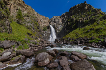 Naklejka na ściany i meble Waterfall in Altay mountains. Beautiful nature landscape. Popular touristic destination.