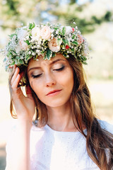 Obraz premium Tender young caucasian woman wearing white wreath