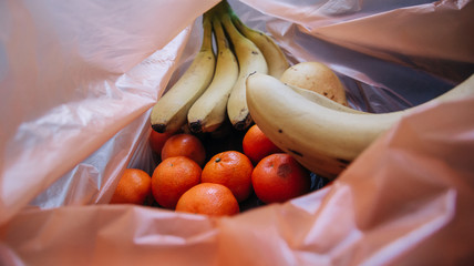 plastic bag full of fruit
