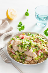 chicken breast with couscous, cucumber, avocado, spring onion, radish. healthy lunch