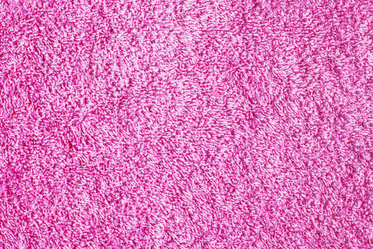 Soft textile pink fabric. Plush towel closeup macro background.