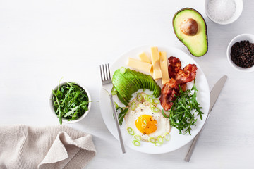 healthy keto breakfast: egg, avocado, cheese, bacon