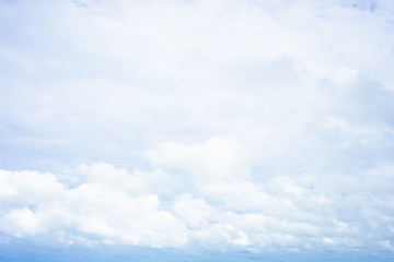 The sky is bright blue. There are clouds floating through. Feel relax when looking. See the sun on the sun.