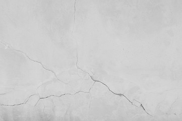 Weiße Betonoberfläche mit Beschädigung