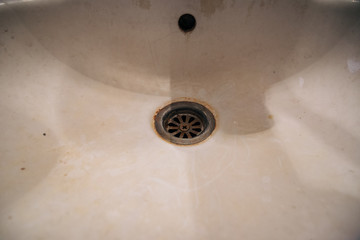 dirty bathroom sink and faucet