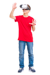 Full length portrait of young caucasian teen boy using virtual reality goggles. Funny teenager looking in VR glasses. Handsome child experiencing 3D gadget technology, isolated on white background. - 281065706