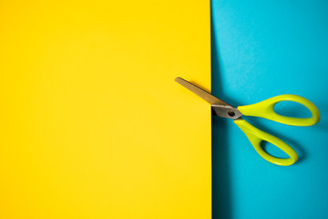 Scissors cutting paper no one holding them 