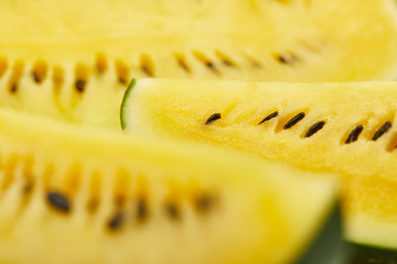 close up view of ripe yellow tasty watermelon with seeds