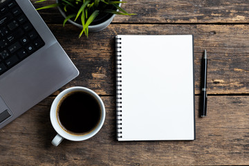 Empty notebook on wooden table top view