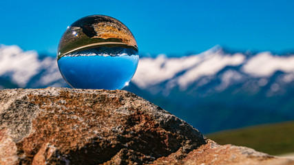 Crystal ball alpine landscape shot at Wildkogel Arena, Neukirchen, Salzburg, Austria