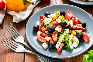 Greek salad with fresh tomatoes, peppers and cucumbers