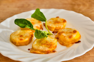 Baked yellow zucchini with mozzarella and parmesan cheese