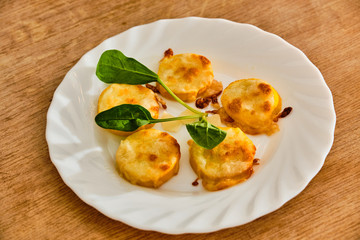Baked yellow zucchini with mozzarella and parmesan cheese