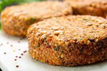 Tasty vegetarian burgers made from healthy quinoa, basil, tomatoes and mozzarella cheese