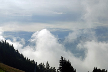 rising fog in the morning in the mountains