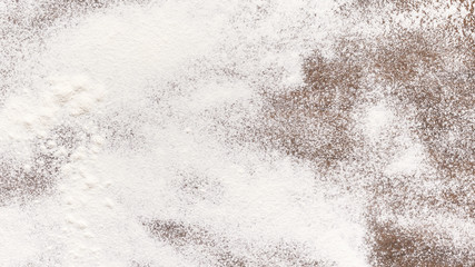 Sprinkled wheat flour on wooden table, empty space