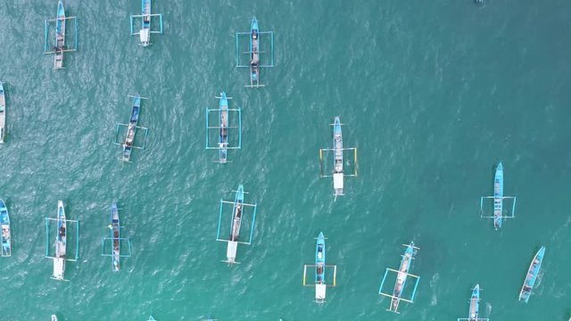Top down view of traditional fisherman boats anchoring on the Papuma Beach, Jember, East Java, Indonesia. Shot in 4k resolution