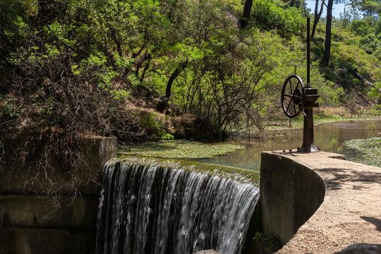 Floodgate and waterfall on Seven Springs or Epta Piges Rhodes Greece. Sunny sumer day