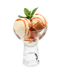 Delicious ice cream with caramel and mint in glass dessert bowl on white background
