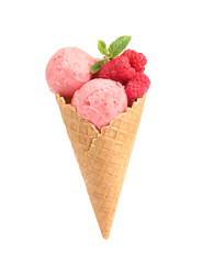 Delicious pink ice cream with raspberries and mint in waffle cone on white background