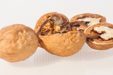 walnuts in basket isolated on white