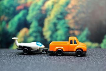 Fototapeta na wymiar toy truck on the road aviation