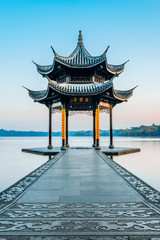 Jixian pavilion during sunrise in Hangzhou, Zhejiang province, China with all Chinese words on it...