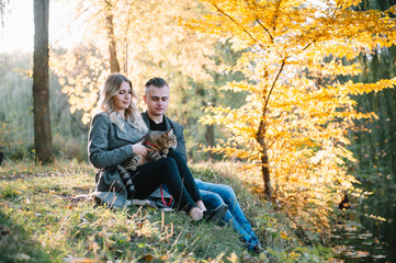 Fototapeta premium love, relationship, family and people concept - smiling couple having fun in autumn park