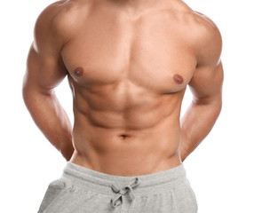 Fototapeta premium Young man with slim body on white background, closeup view