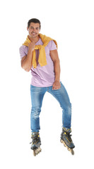 Handsome young man with inline roller skates on white background