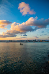 Sanya town evening cityscape, view from Phoenix island on Hainan Island of China