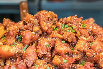 Chinese street food grilled pig's feet closeup