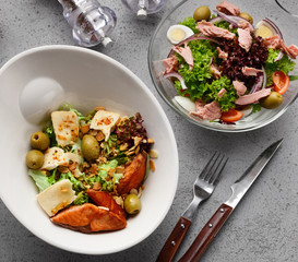 Healthy salads in unusual bowls for lunch, closeup