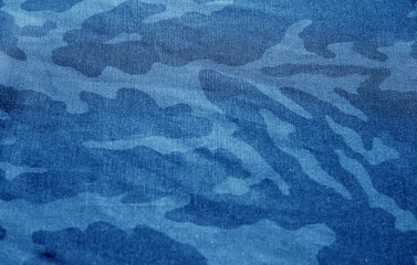 Dirty camouflage cloth with blur effect in navy blue tone.