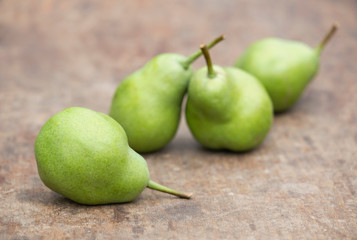Healthy green pears on a wooden table