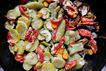 Tasty summer food. Roasted vegetables: zucchini, peppers, carrots, modiors and potatoes.