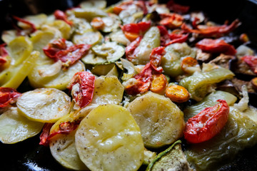 Fototapeta na wymiar Tasty summer food. Roasted vegetables: zucchini, peppers, carrots, modiors and potatoes.