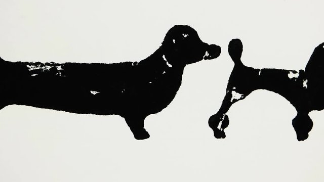 Black silhouettes of dachshund and poodle on the white background, graphic arts