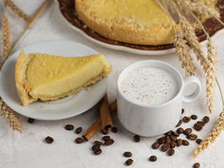 a Cup of coffee latte and homemade cake with cottage cheese