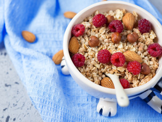 Fresh muesli with nuts and raspberries