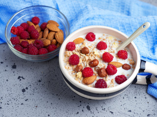 Fresh muesli with nuts and raspberries