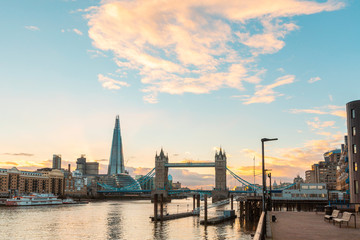 Naklejka premium London view at sunset with Tower Bridge and modern buildings