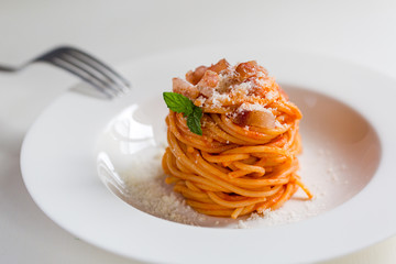 Homemade Amatriciana - Italian pasta based on guanciale (cured pork cheek), pecorino cheese,...